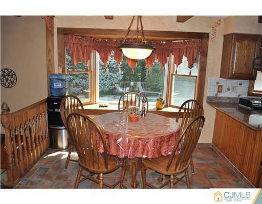 64 Ridge Road Edison, NJ 08817 - Photo 8 of 22 a view of a dining room with furniture window and outside view