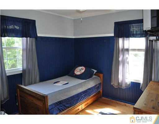 64 Ridge Road Edison, NJ 08817 - Photo 10 of 22 a bedroom with a bed and a window
