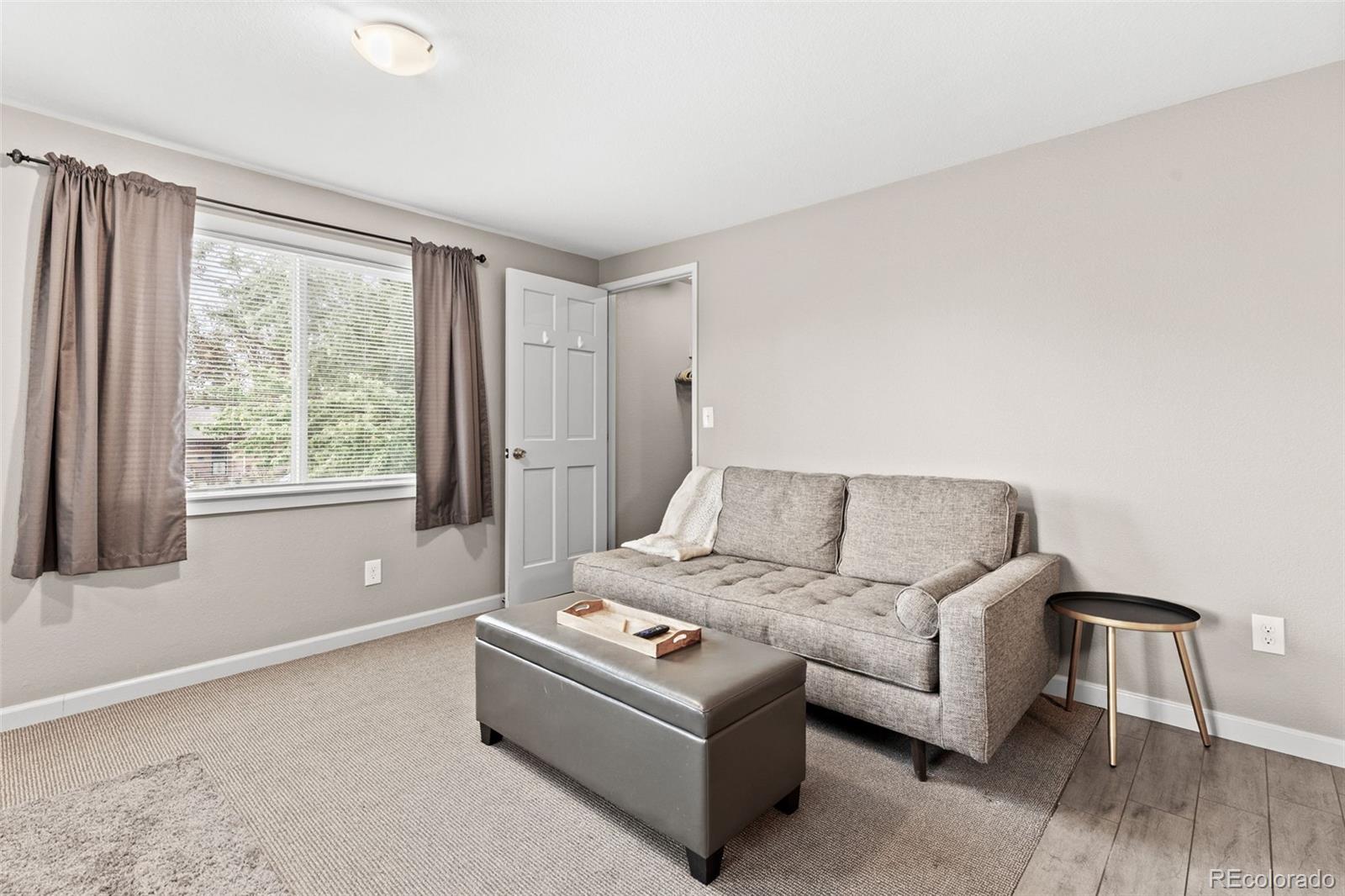 6595 West 46th Place Wheat Ridge, CO 80033 - Photo 32 of 48 a living room with furniture and a window