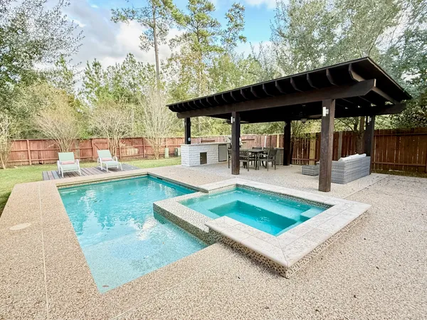 a view of a swimming pool with a patio