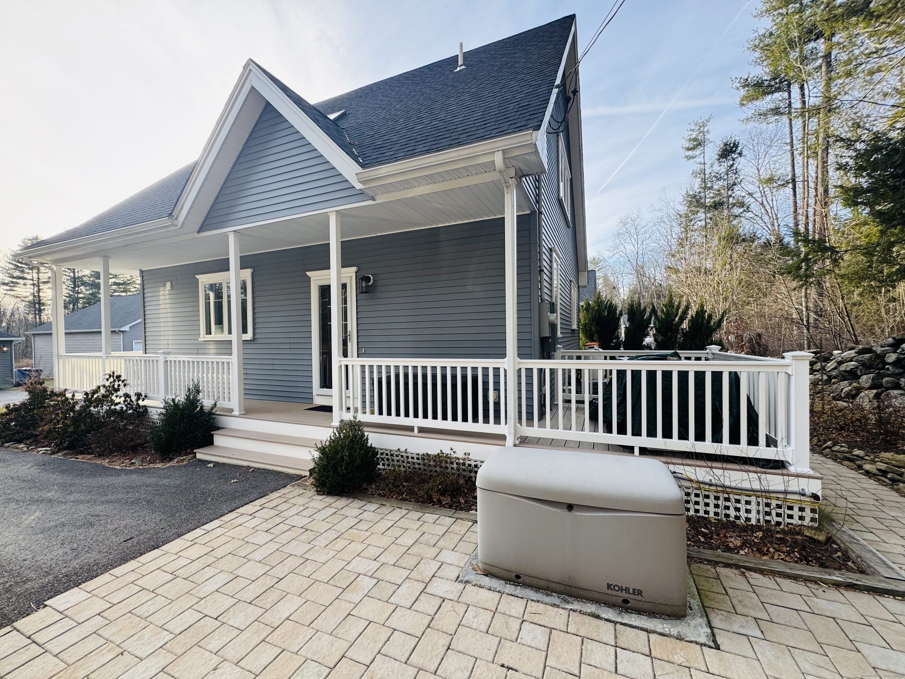 123 Ashford Road, Unit 1 Eastford, CT 06242 - Photo 2 of 24 a view of a chair and tables
