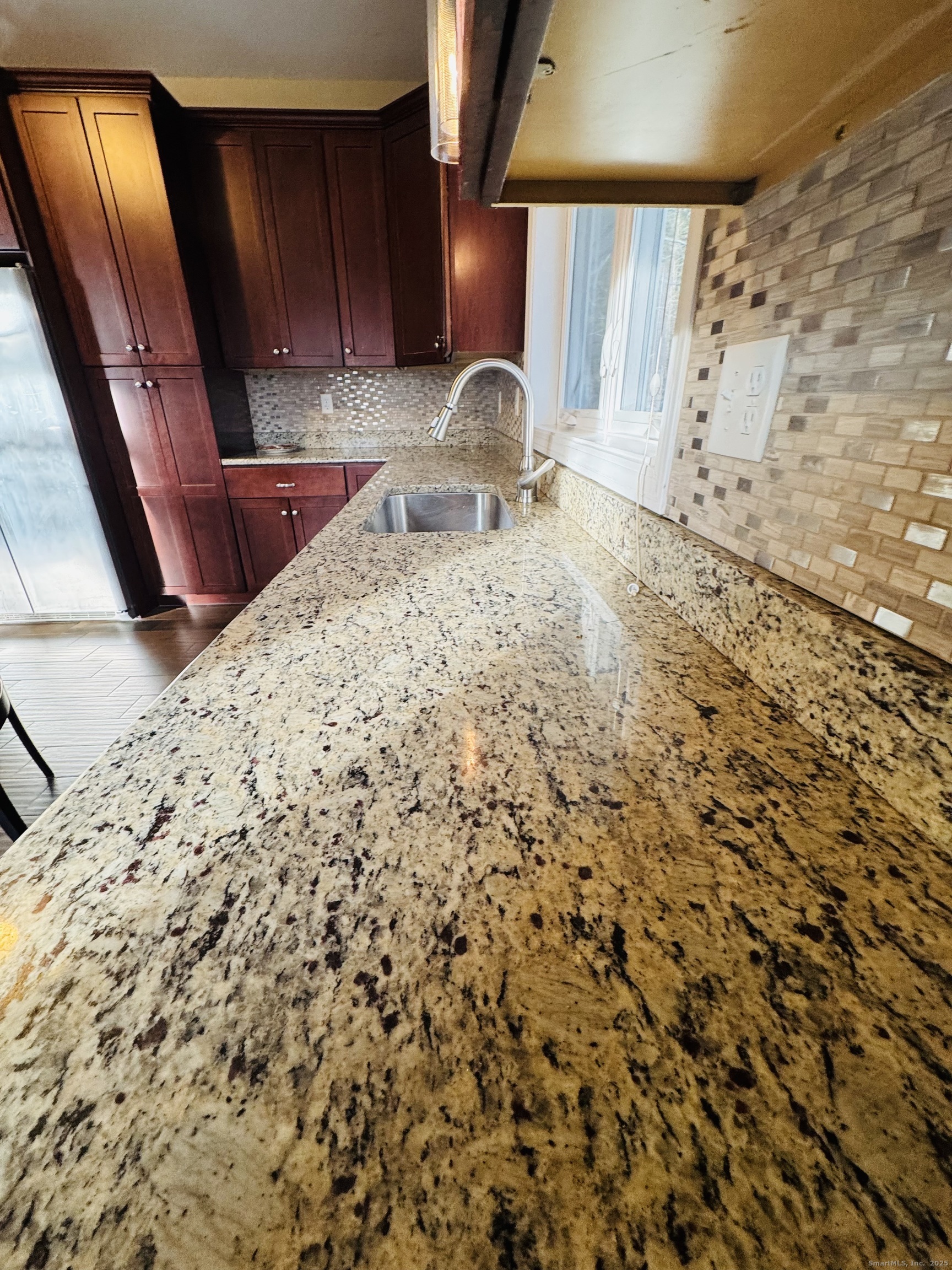123 Ashford Road, Unit 1 Eastford, CT 06242 - Photo 9 of 24 a view of kitchen with cabinets and wooden floor