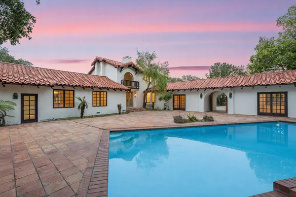 a front view of a house with swimming pool