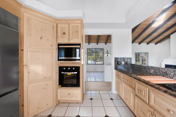 a large kitchen with a stove a refrigerator and a stove