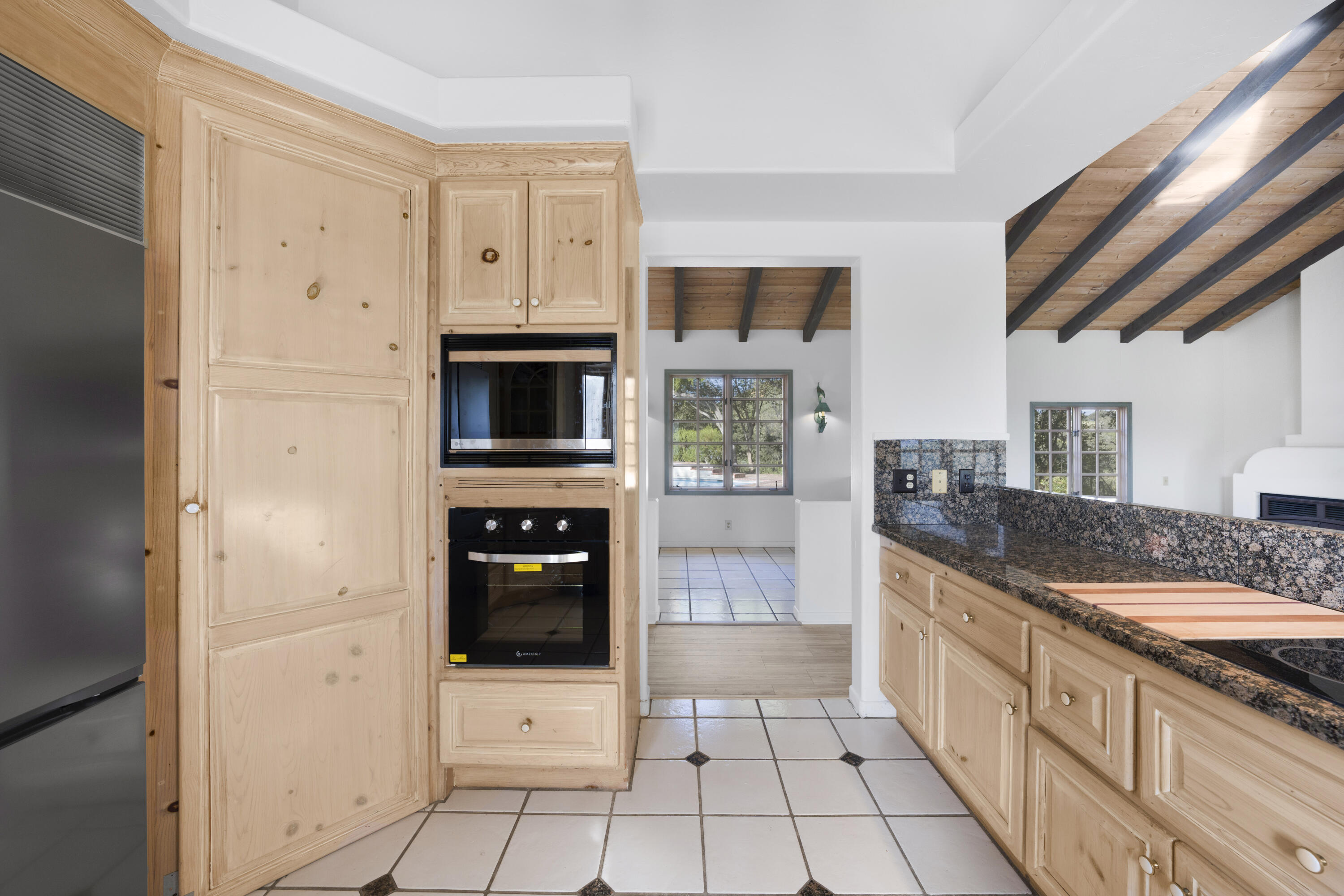 1225 Poppy Valley Road Buellton, CA 93427 - Photo 11 of 42 a large kitchen with a stove a refrigerator and a stove