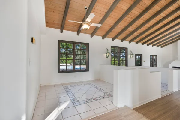 a view of an empty room with windows