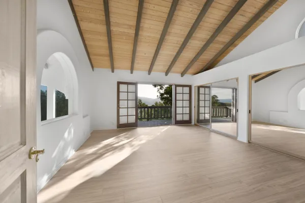 a view of an empty room with a window