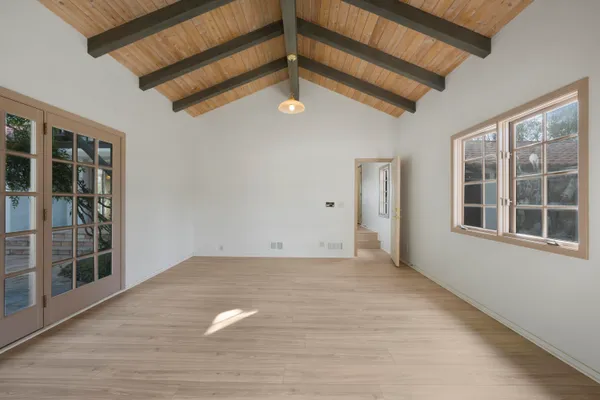 a view of a livingroom with a ceiling fan and window