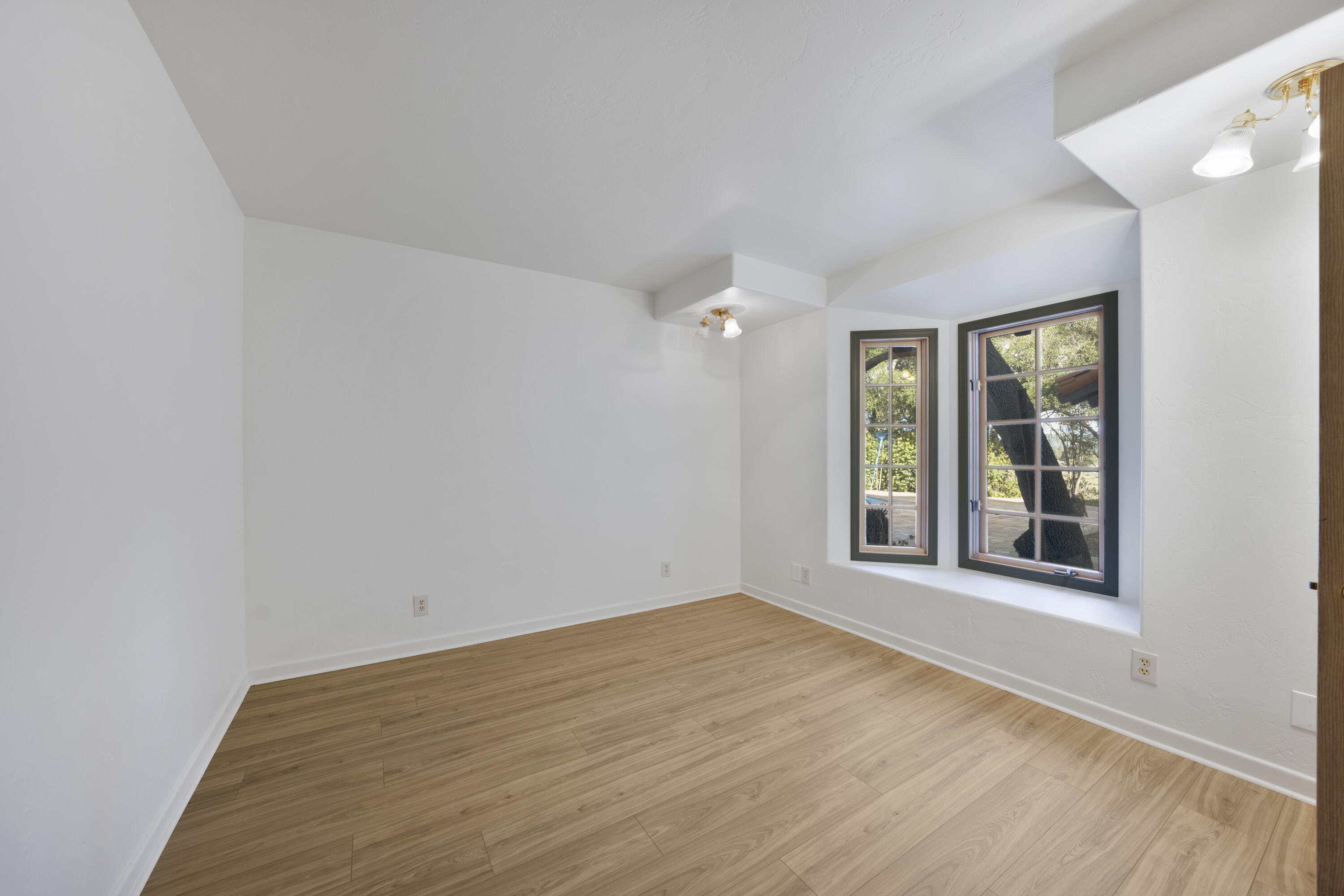 1225 Poppy Valley Road Buellton, CA 93427 - Photo 23 of 42 wooden floor in an empty room with a window