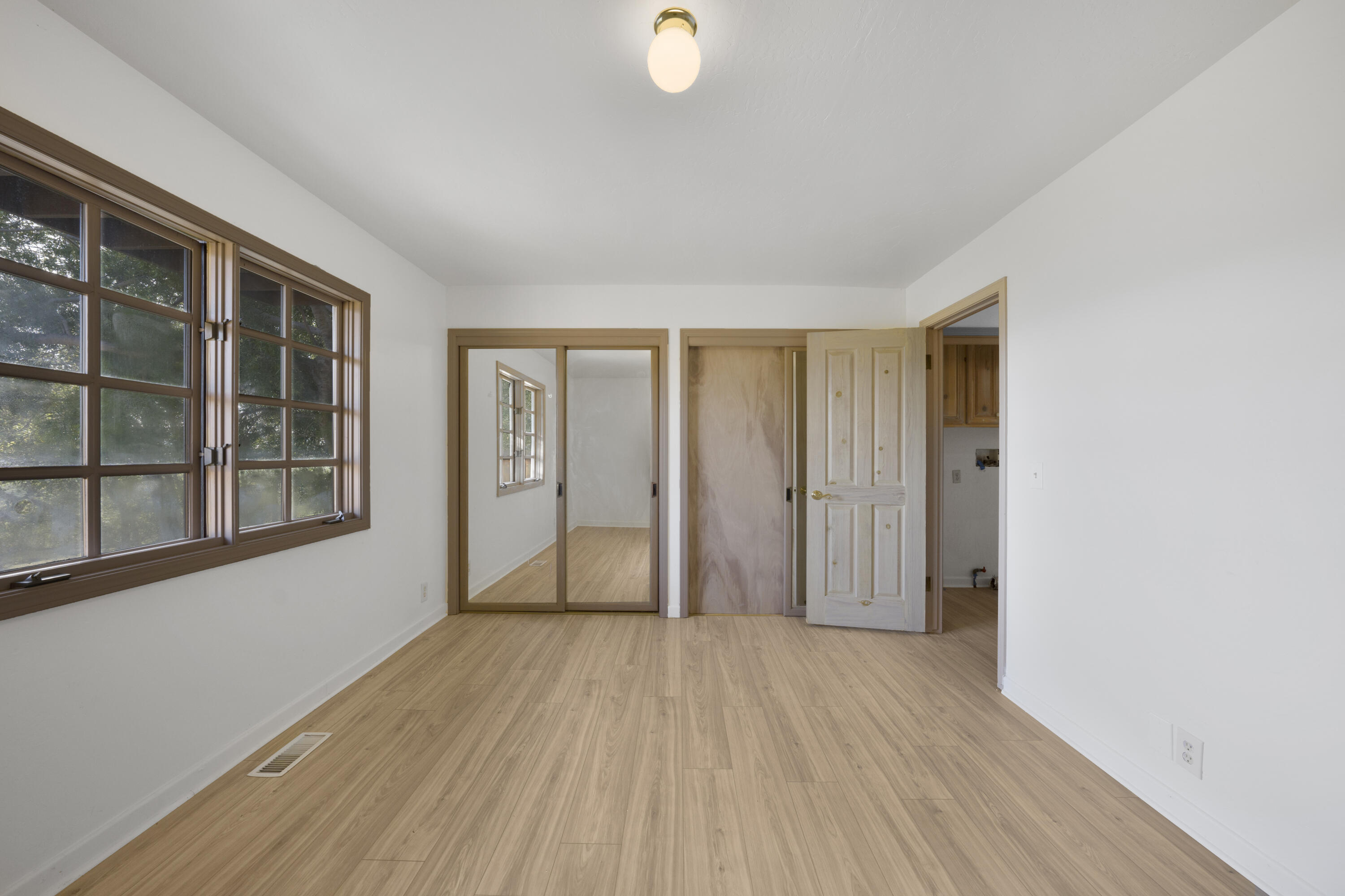 1225 Poppy Valley Road Buellton, CA 93427 - Photo 24 of 42 wooden floor in an empty room with a window