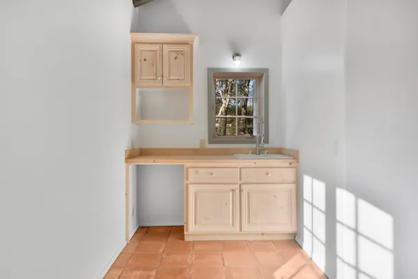 a view of cabinets and window