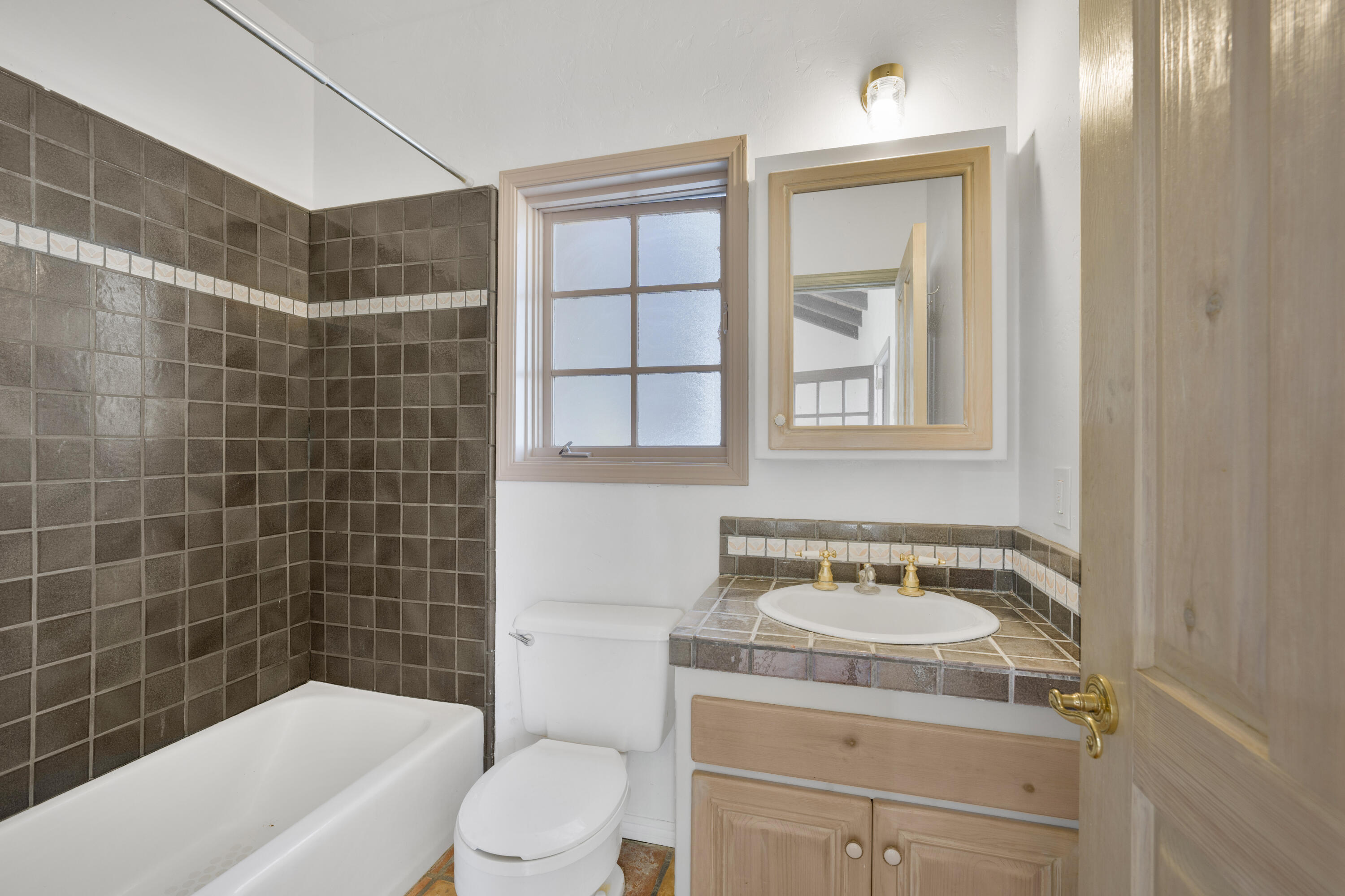 1225 Poppy Valley Road Buellton, CA 93427 - Photo 33 of 42 a bathroom with a sink toilet vanity and bathtub