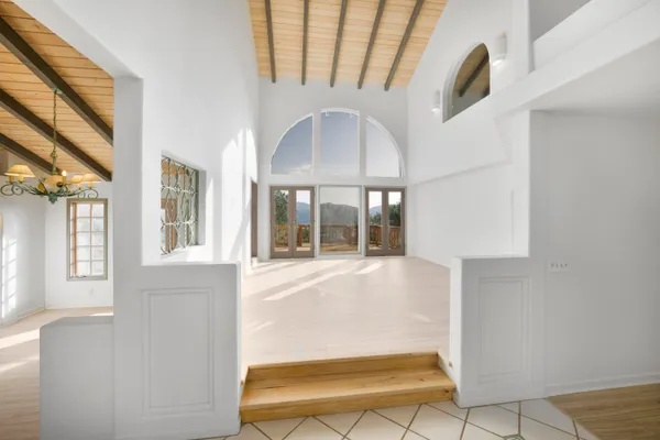 a view of an entryway with a floor to ceiling window