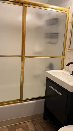 a bathroom with a sink and a mirror