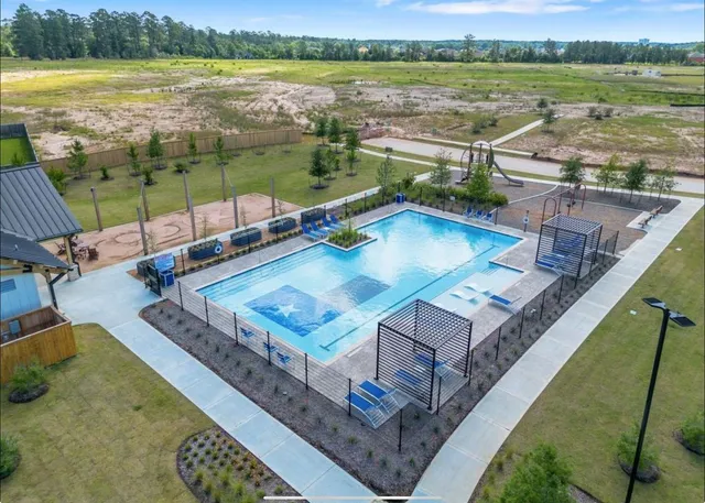 an aerial view of a house with a lake view