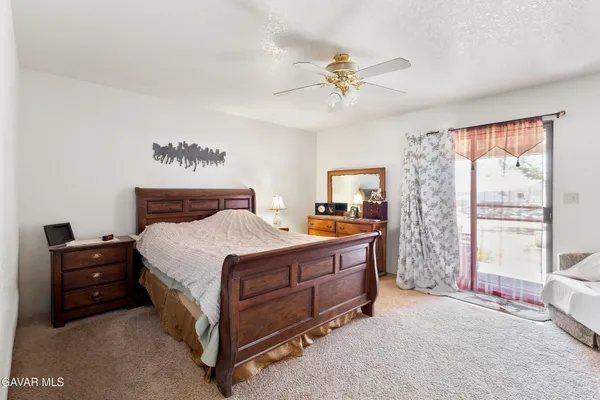 a bed room with a bed and a tv