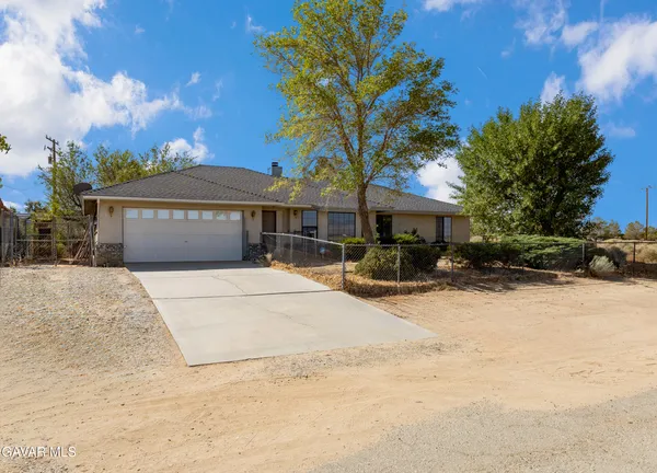 a front view of a house with a patio