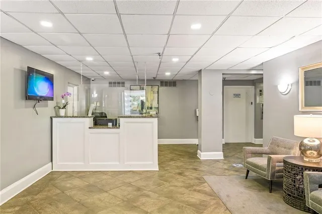 a view of a livingroom with furniture and a flat screen tv