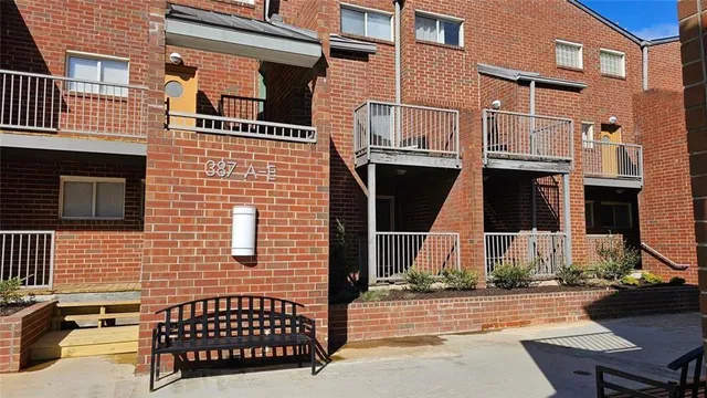 front view of a brick house with a street