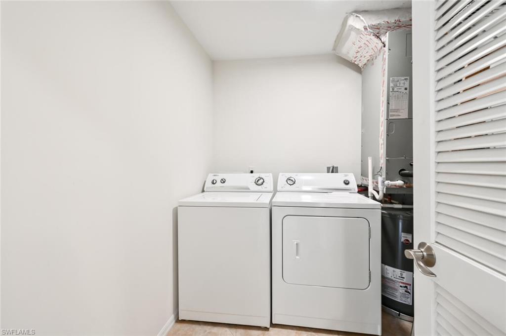 515 Gabriel Circle, Unit 1910 Naples, FL 34104 - Photo 16 of 29 a utility room with dryer and washer