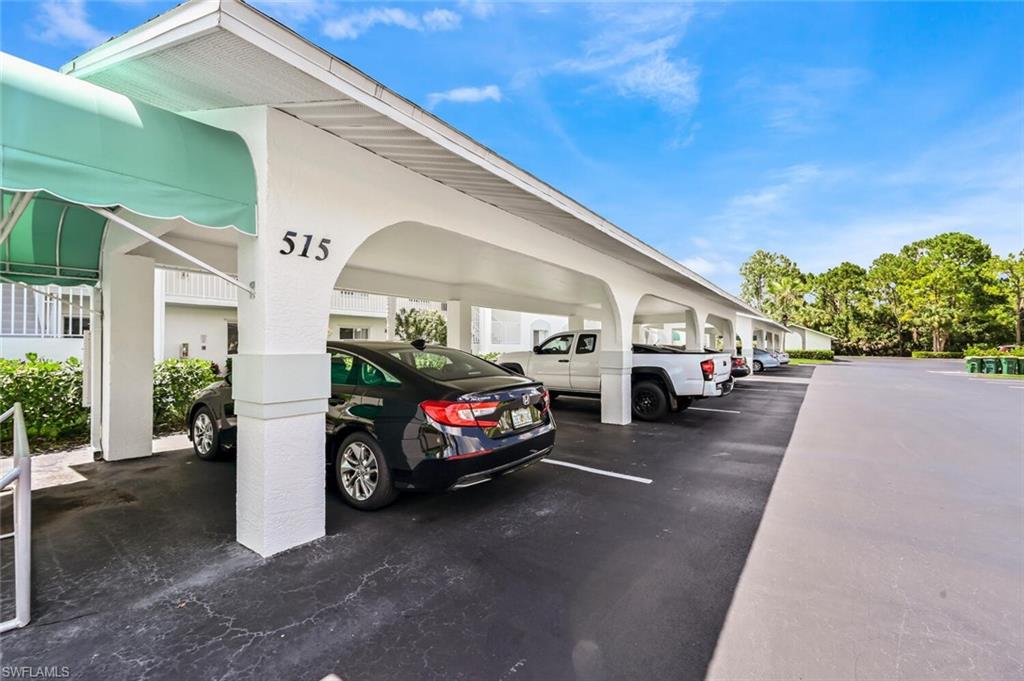 515 Gabriel Circle, Unit 1910 Naples, FL 34104 - Photo 19 of 29 a view of a cars parking space