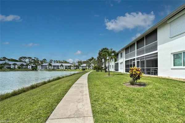 a view of a lake with a yard