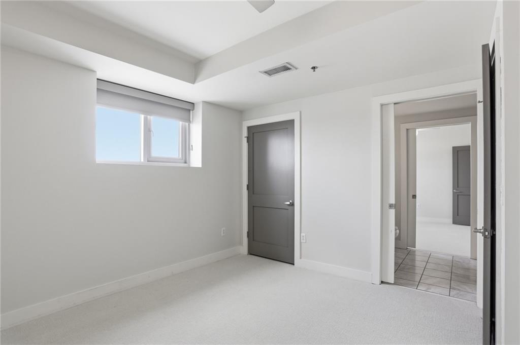 1100 Howell Mill Road Northwest, Unit 608 Atlanta, GA 30318 - Photo 25 of 37 a view of an empty room