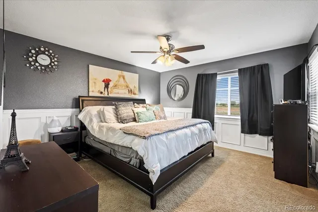 a bed room with a bed and a tv