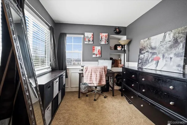 a bedroom with furniture and a window