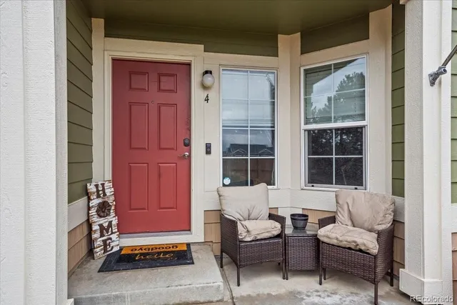 a living room with furniture and windows