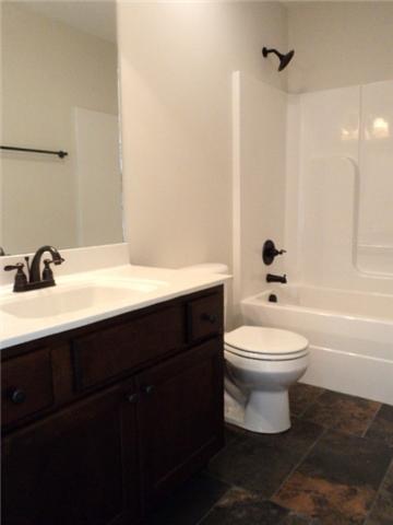 408 Sycamore Drive Springfield, TN 37172 - Photo 11 of 13 Guest bath with shower/tub combo tile and upgraded oil rubbed bronze faucets!