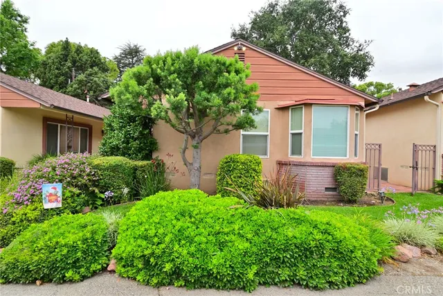 a view of a yard in front view of a house