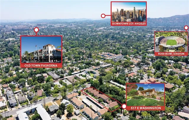 a view of a house with a big yard plants and palm trees