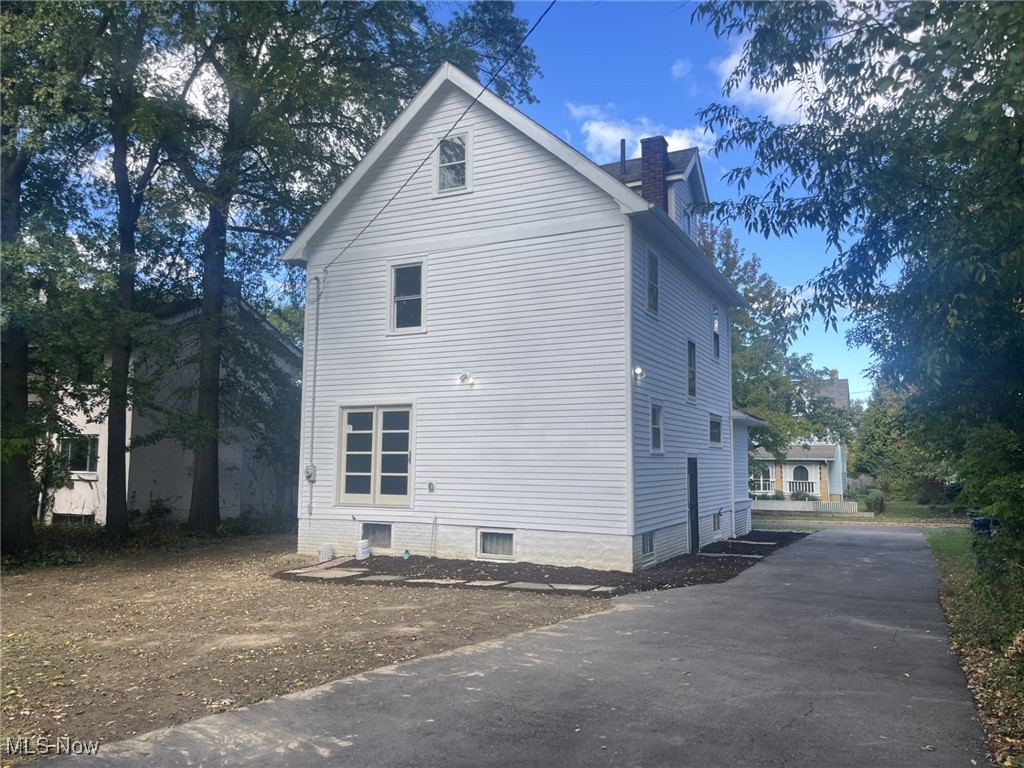 3264 Altamont Road Cleveland, OH 44118 - Photo 28 of 32 View of side of property with a chimney and driveway