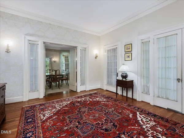 a bedroom with furniture and a rug