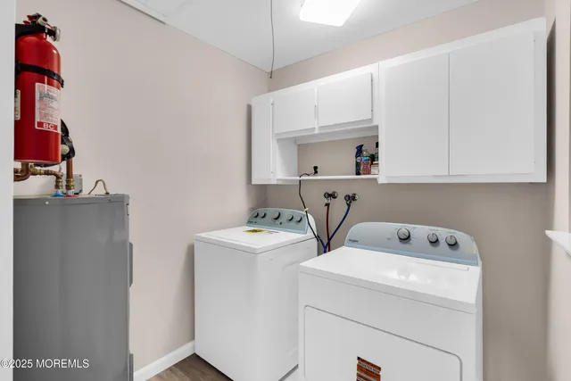 a view of storage and utility room with washer and dryer