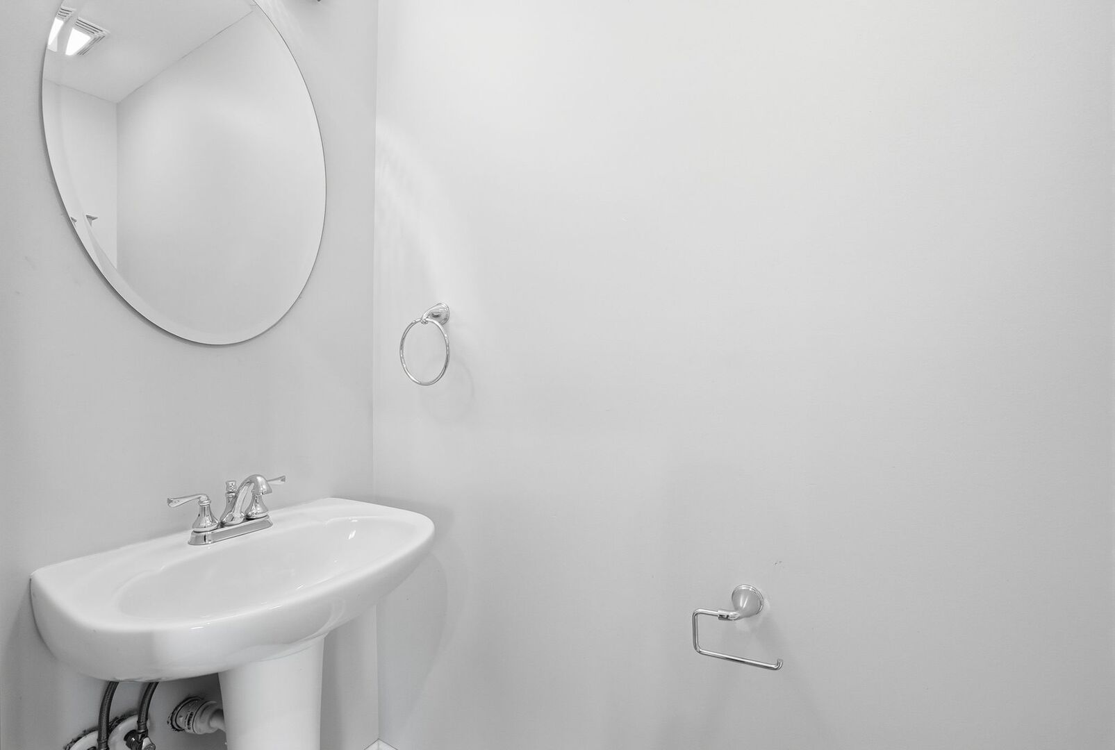 8718 Cranbrook Lane Bridgeview, IL 60455 - Photo 12 of 24 a bathroom with a sink a mirror and a toilet