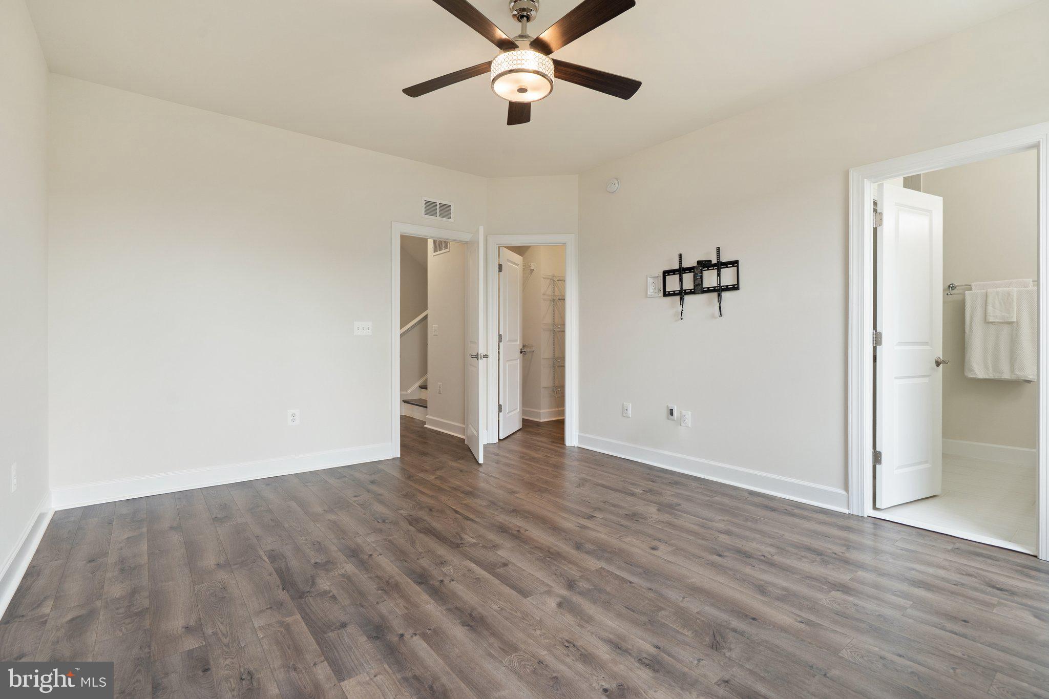 45397 Daveno Square Sterling, VA 20164 - Photo 14 of 44 wooden floor in an empty room with a window