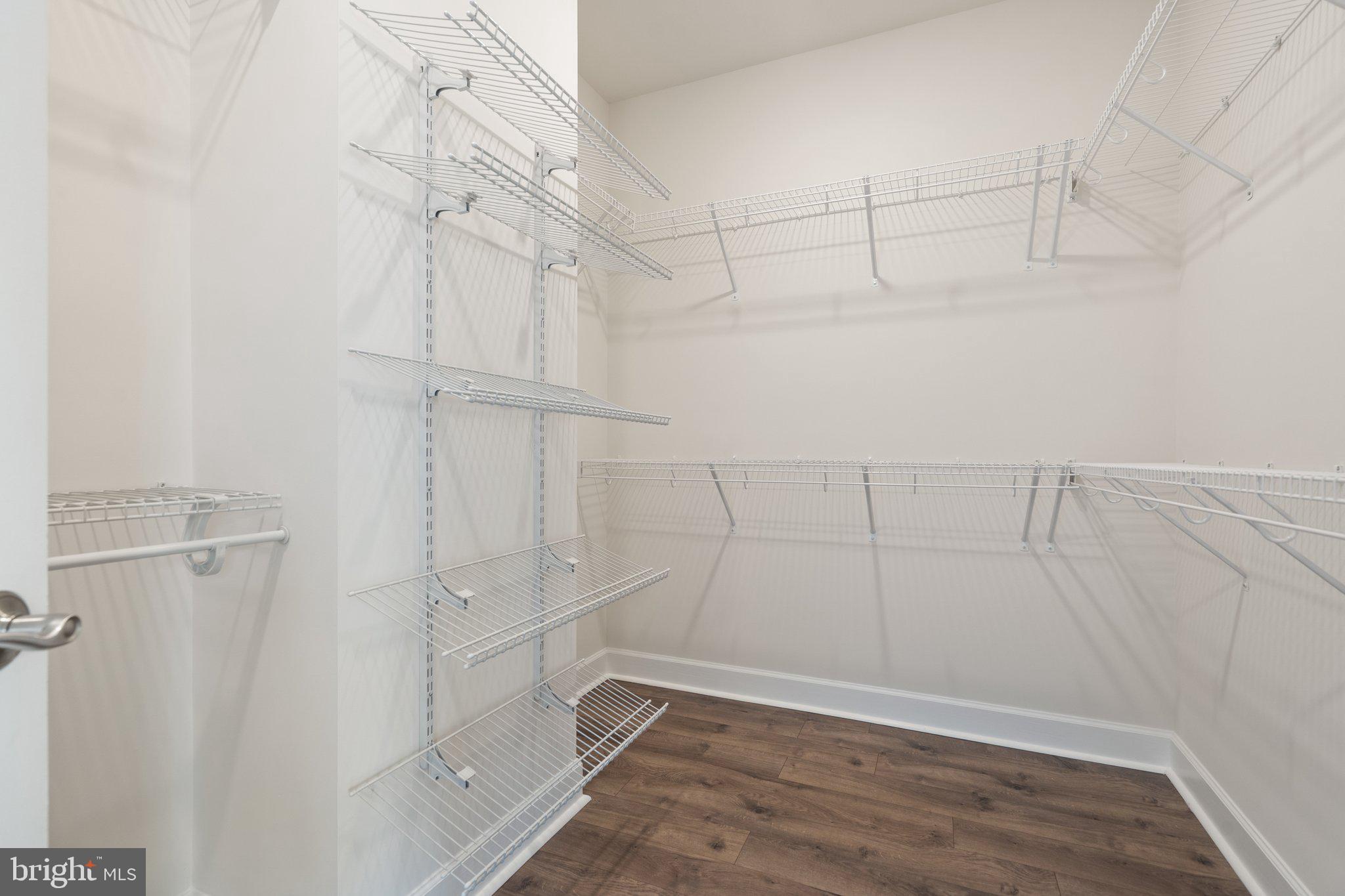 45397 Daveno Square Sterling, VA 20164 - Photo 16 of 44 a view of a room with racks on the wall