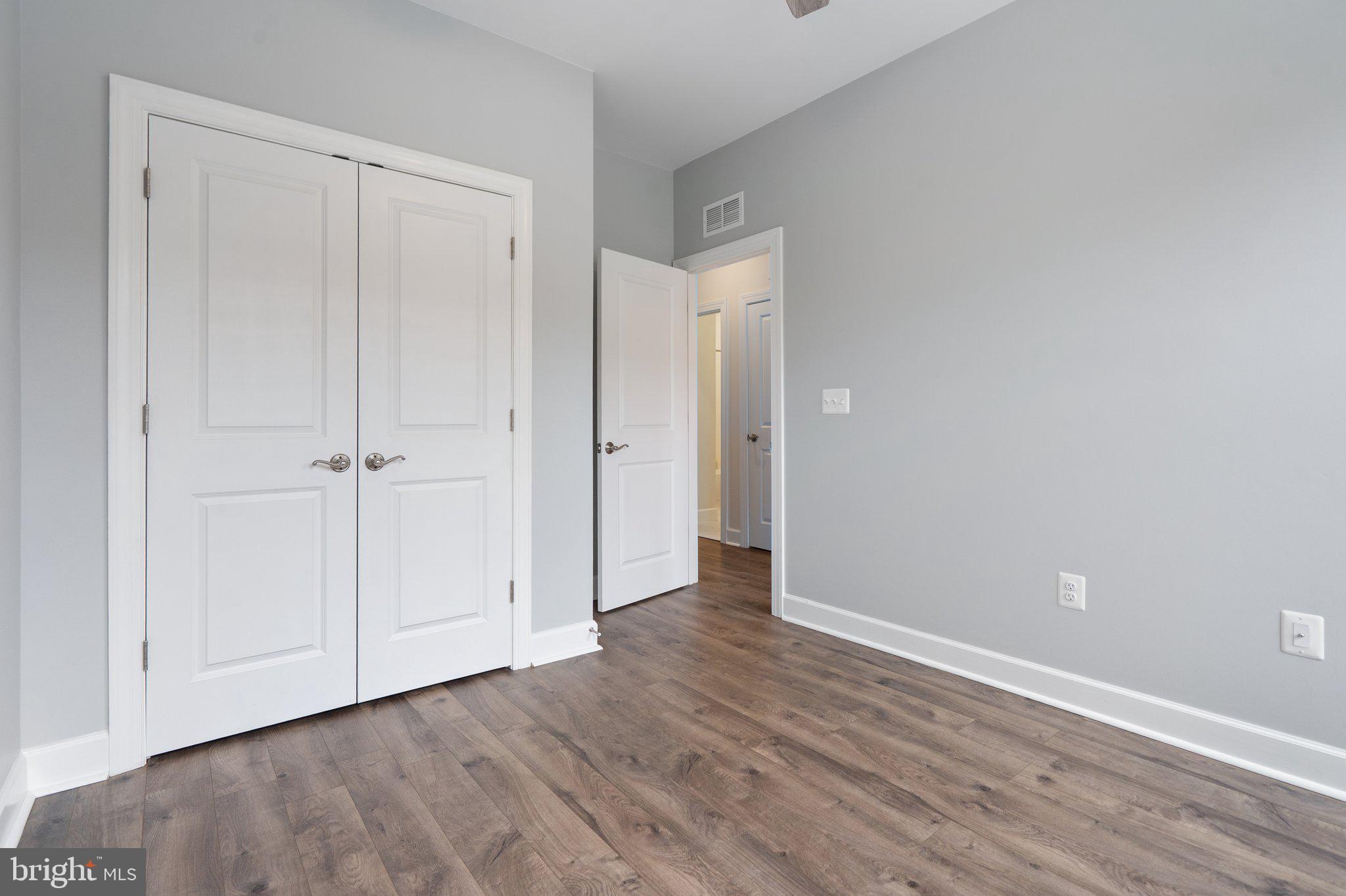 45397 Daveno Square Sterling, VA 20164 - Photo 20 of 44 a view of an empty room with wooden floor