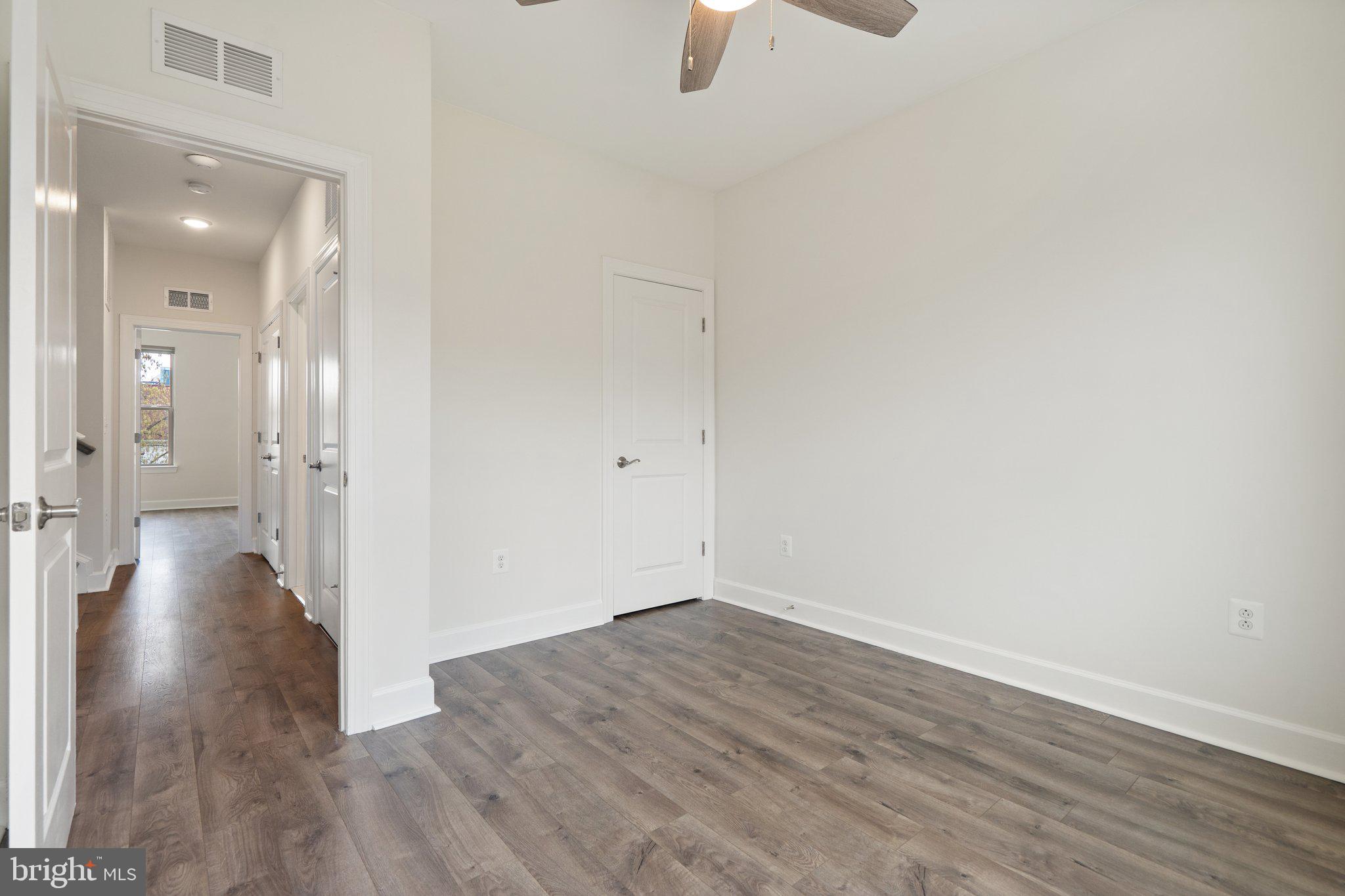 45397 Daveno Square Sterling, VA 20164 - Photo 22 of 44 a view of a hallway with wooden floor