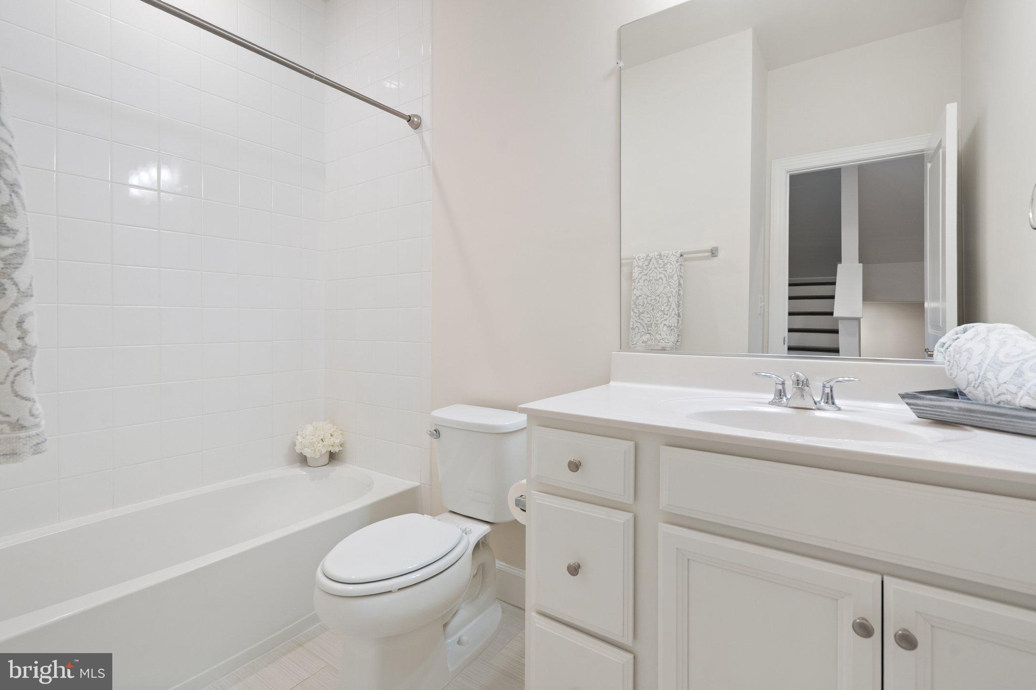 45397 Daveno Square Sterling, VA 20164 - Photo 23 of 44 a bathroom with a sink a toilet and shower