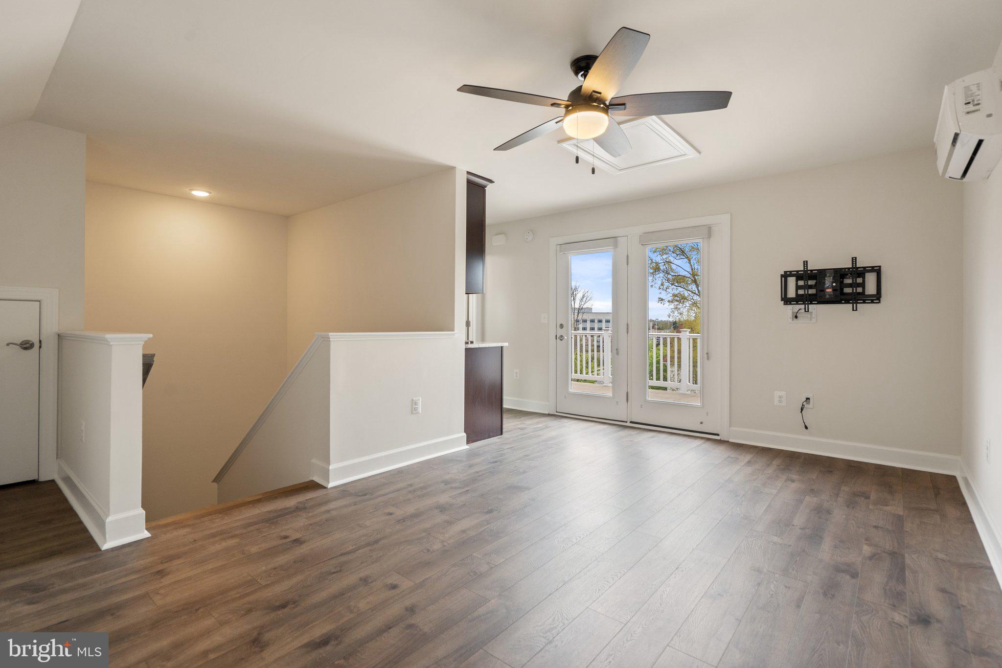 45397 Daveno Square Sterling, VA 20164 - Photo 25 of 44 wooden floor in an empty room with a window