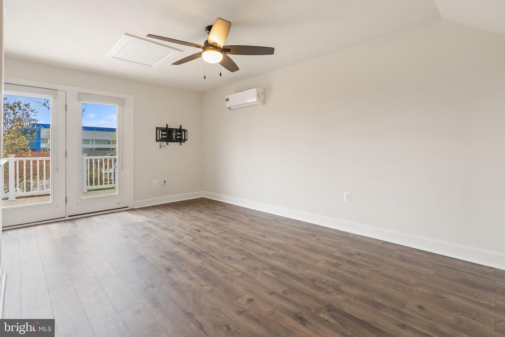 45397 Daveno Square Sterling, VA 20164 - Photo 26 of 44 wooden floor in an empty room with a window