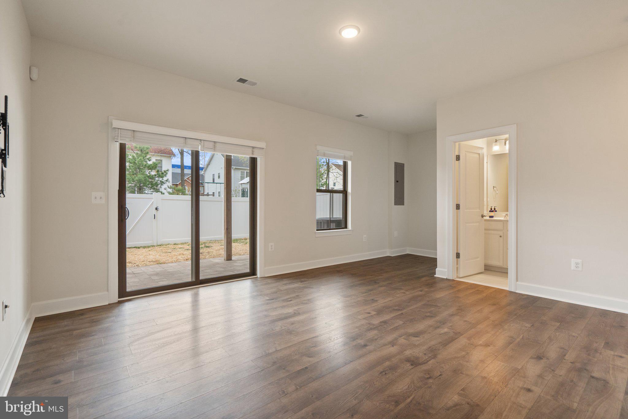 45397 Daveno Square Sterling, VA 20164 - Photo 32 of 44 an empty room with wooden floor and windows