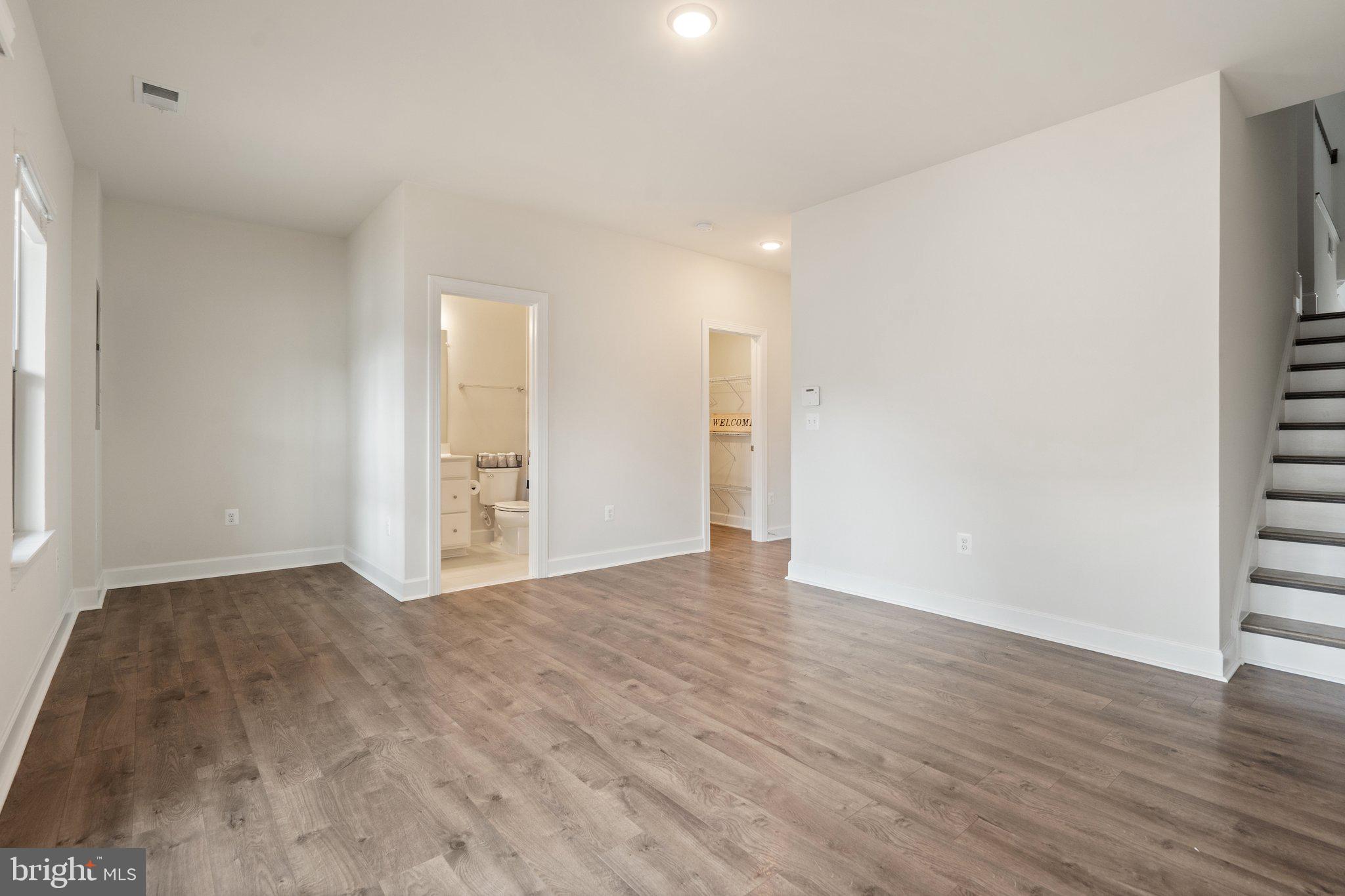 45397 Daveno Square Sterling, VA 20164 - Photo 33 of 44 a view of an empty room with wooden floor and a window