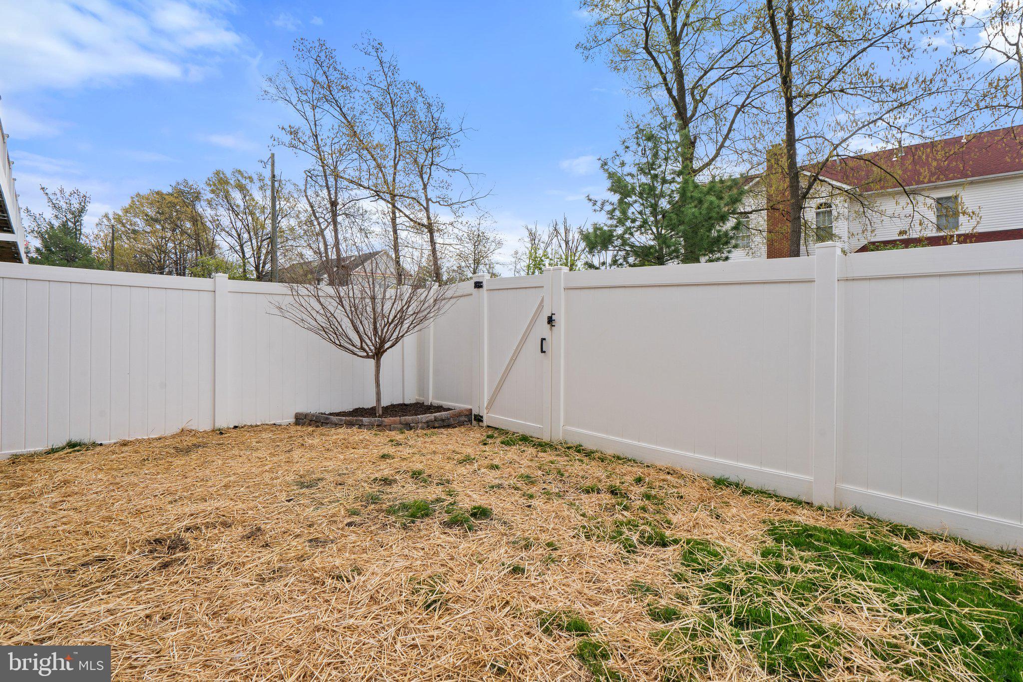 45397 Daveno Square Sterling, VA 20164 - Photo 41 of 44 a view of a white house with a large tree