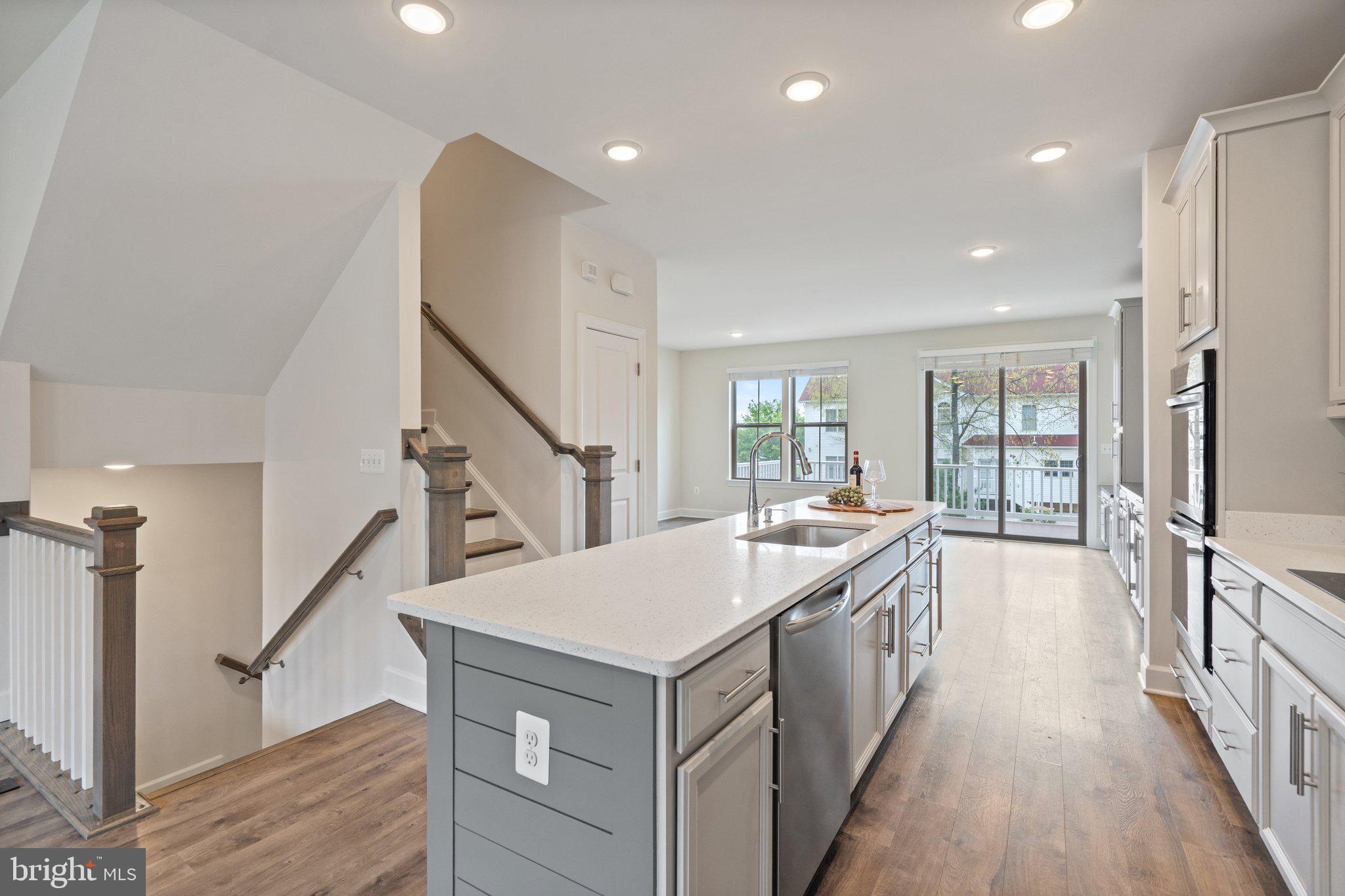 45397 Daveno Square Sterling, VA 20164 - Photo 7 of 44 a large white kitchen with a large window