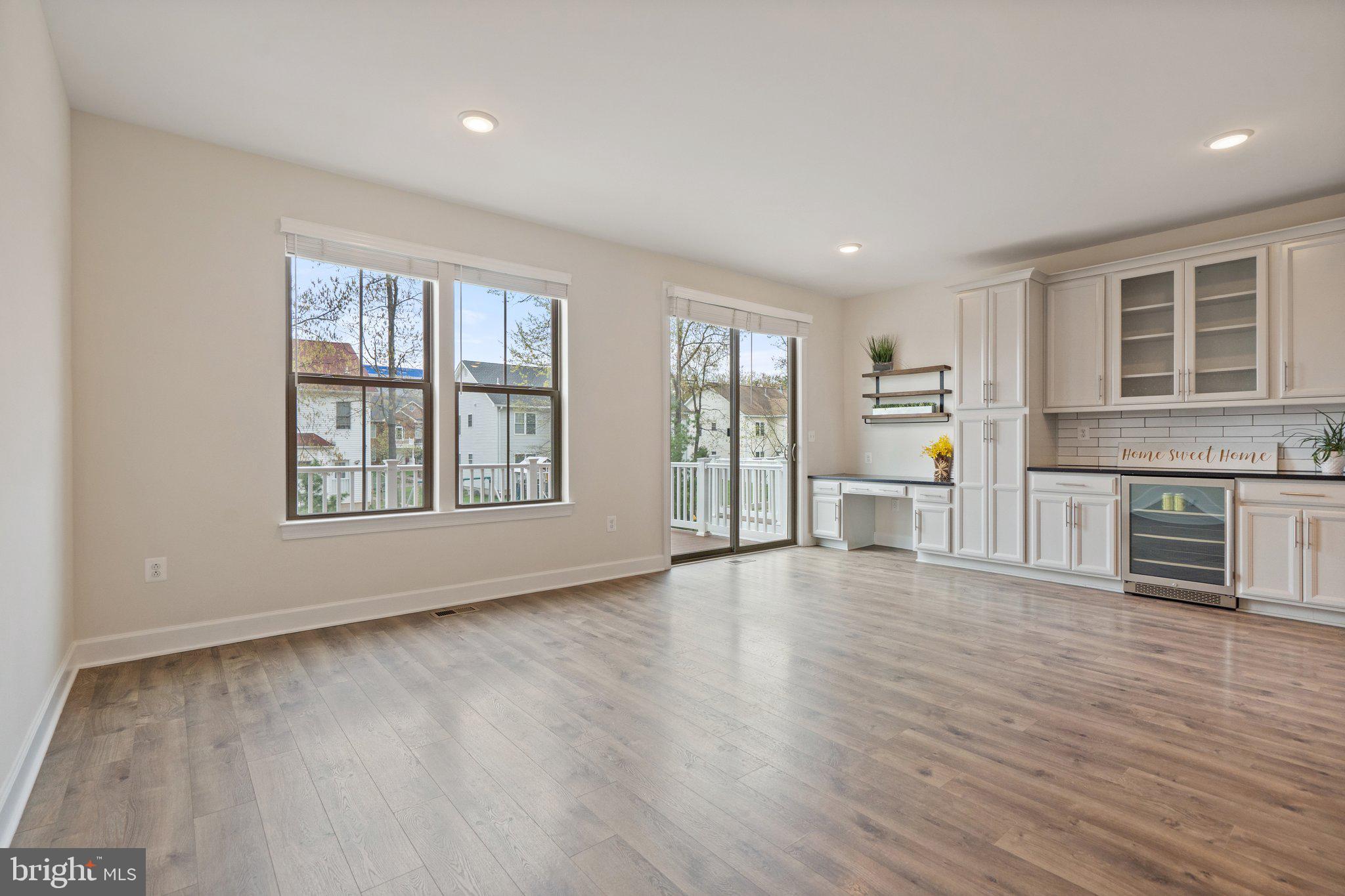 45397 Daveno Square Sterling, VA 20164 - Photo 9 of 44 a view of an empty room with window and wooden floor