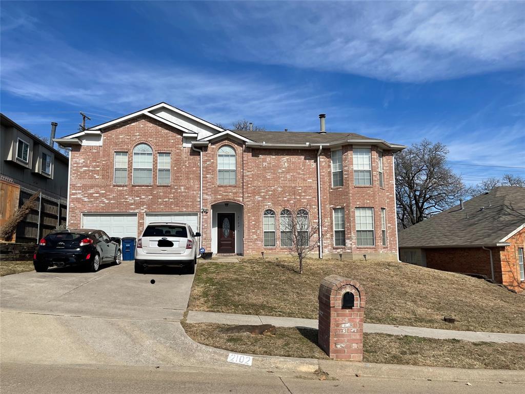 2102 Brazos Drive Corinth, TX 76210 - Photo 1 of 1 a front view of a house with parking space